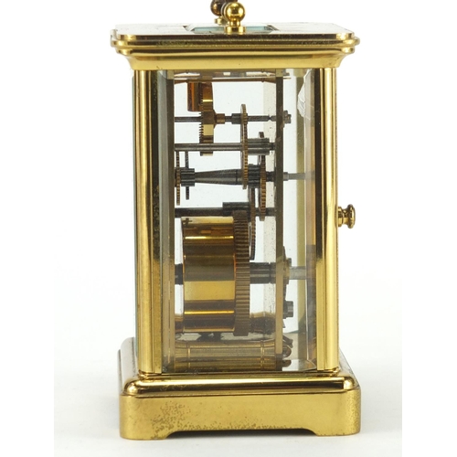 146 - Matthew Norman brass cased carriage clock, with swing handle and bevelled glass, 11cm high