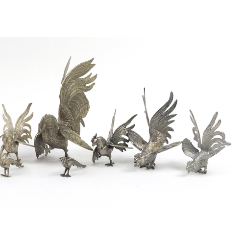 469 - Thirteen silver plated cockerels and pheasants, the largest 23cm high