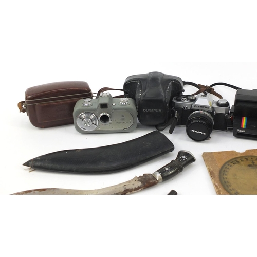 852 - Miscellaneous items including an oak biscuit barrel, Ghurkha's knife and vintage cameras