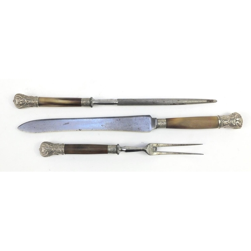 714 - Horn handled three piece carving set, with silver coloured metal finials, housed in a fitted tooled ... 