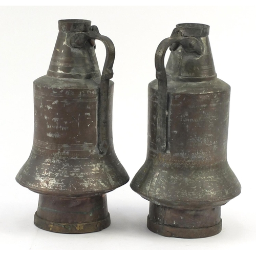 71 - Pair of Middle Eastern copper vessels both inscribed Mustafa, 42.5cm high