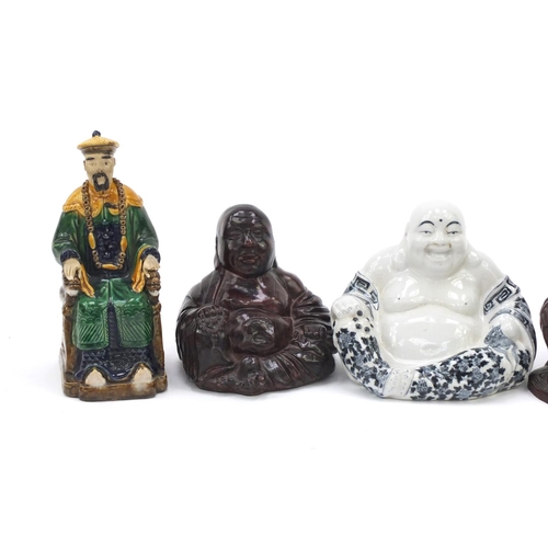 184 - Oriental figures including carved wooden Buddha and a pottery model of a seated Emperor, the largest... 