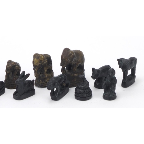 704 - Cast metal animals including elephants, the largest 4.5cm high