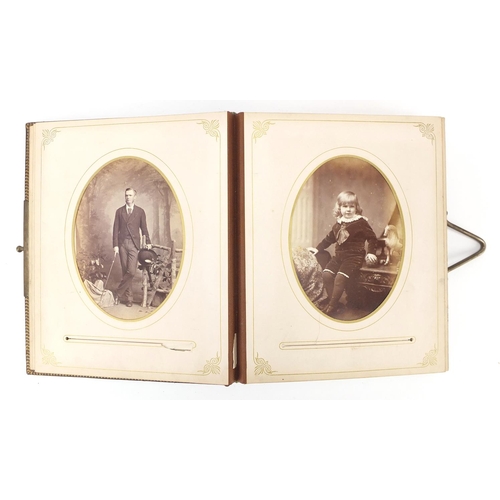 952 - Victorian leather photograph album with black and white portrait cabinet cards