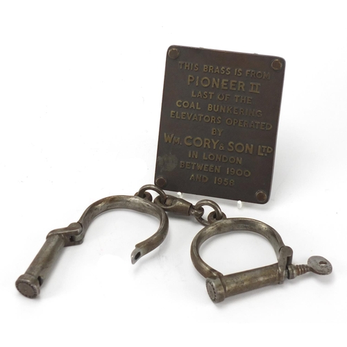 652 - 19th century Haitt steel handcuffs and a coal mining brass plaque