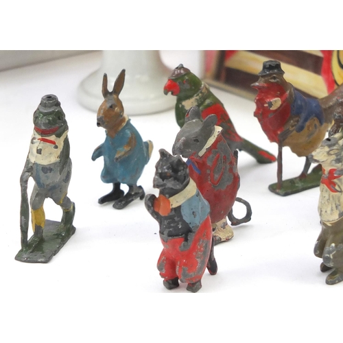 565 - Vintage toys including hand painted lead figures and carousels