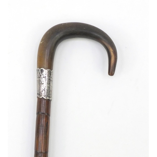 715 - Bamboo walking stick with horn handle and silver collar, 88cm in length