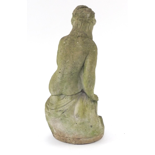29 - Stoneware garden figure of a semi nude female, 58cm high