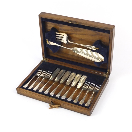 66 - Oak six place canteen of silver plated fish knives, forks and servers