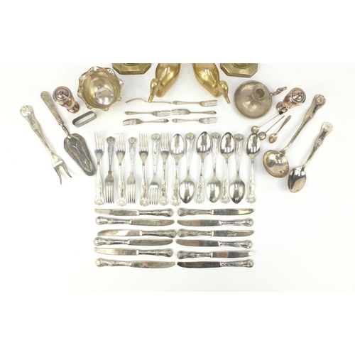 250 - Silver plate and brassware including a pair of Victorian candlesticks and cutlery