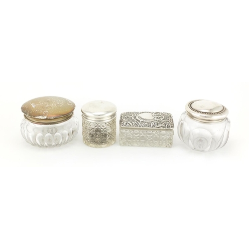2266 - Four cut glass jars with silver lids, various hallmarks, the largest 8.5cm high