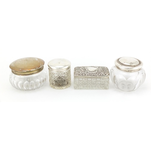 2266 - Four cut glass jars with silver lids, various hallmarks, the largest 8.5cm high