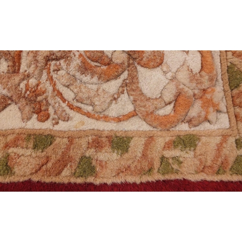 41 - Red and cream ground floral rug, 180cm x 124cm