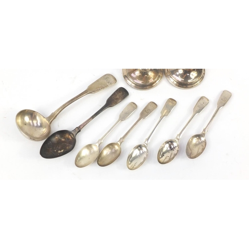 573 - Silver items comprising pair of candlesticks, set of five Victorian teaspoons, Georgian tablespoon a... 