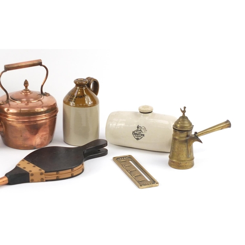 877 - Metal and stoneware including copper coal scuttle, copper teapot, fire bellows and advertising bottl... 