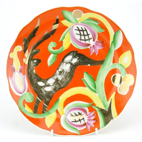 794 - Russian porcelain plate hand painted with a leaping deer and stylised flowers onto an orange ground,... 