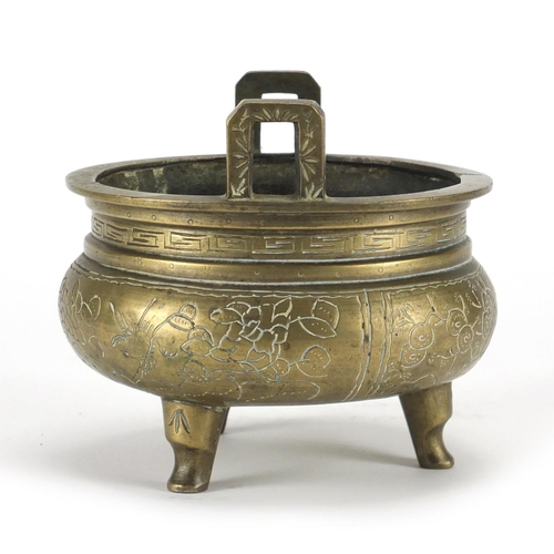 739 - Chinese bronze tripod incense burner with twin handles, engraved with flowers, six figure character ... 