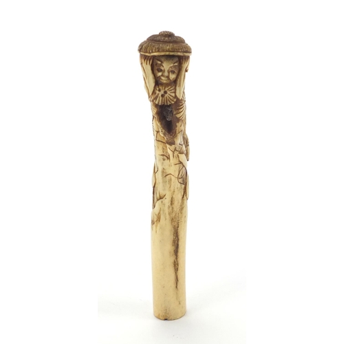609 - Chinese bone parasol handle carved with two figures and trees, 16cm in length