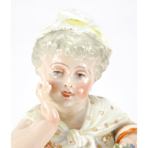525 - 19th century continental porcelain figure of a young girl holding a basket, factory marks to the bas... 