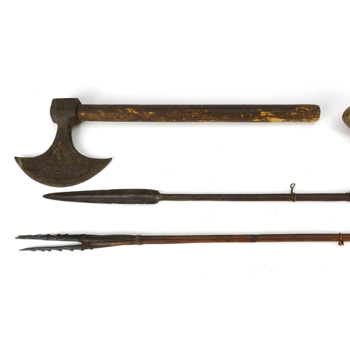 787A - Tribal items including two hunting spears and an axe, the axe head with incised decoration, the larg... 