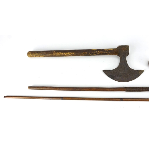 787A - Tribal items including two hunting spears and an axe, the axe head with incised decoration, the larg... 