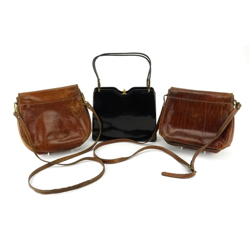 827 - Three vintage handbags comprising two brown leather shoulder bags by The Bridge and an evening bag b... 