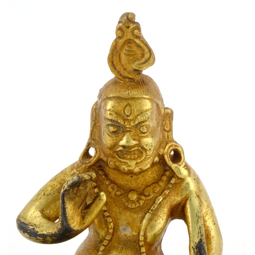 530 - Chino Tibetan gilt figure of seated Buddha, 10cm high