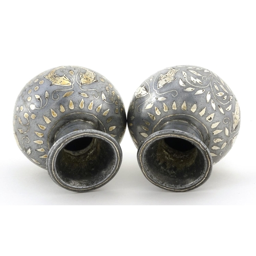 634 - Pair of Indian Bidriware vases, decorated with stylised fish and flowers, each 6.5cm high