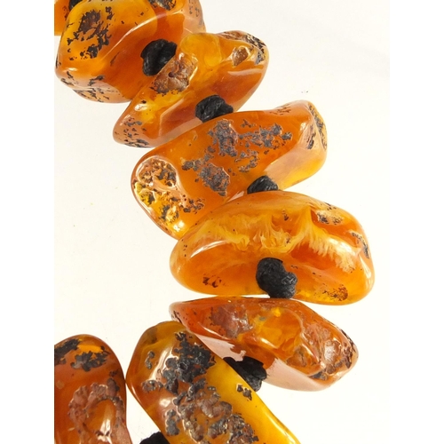 2486 - Baltic amber coloured segment necklace, 62cm in length, approximate weight 121.0g