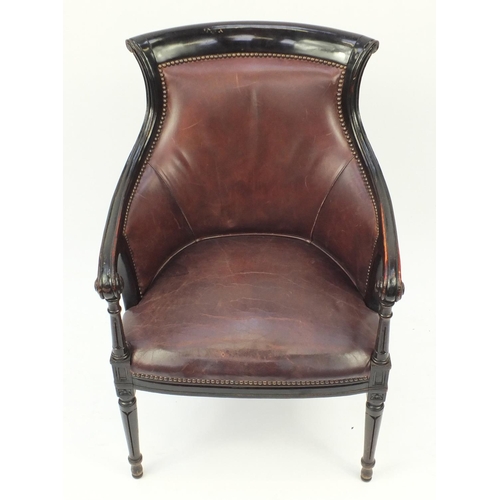 2005 - Mahogany and brown leather library chair on tapering legs, 91cm high