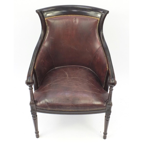 2027 - Mahogany and brown leather library chair on tapering legs, 91cm high