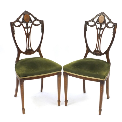 2024 - Pair of inlaid mahogany shield back occasional chairs with green stuff over seats, raised on square ... 