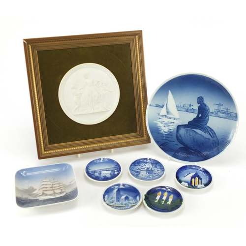 2130 - Danish porcelain including a Royal Copenhagen Parian plaque and five pin dishes, the largest 21cm in... 
