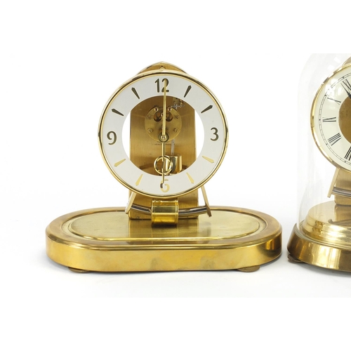 2112 - Two Kundo clocks including an Anniversary example under glass dome with Roman numerals, the largest ... 