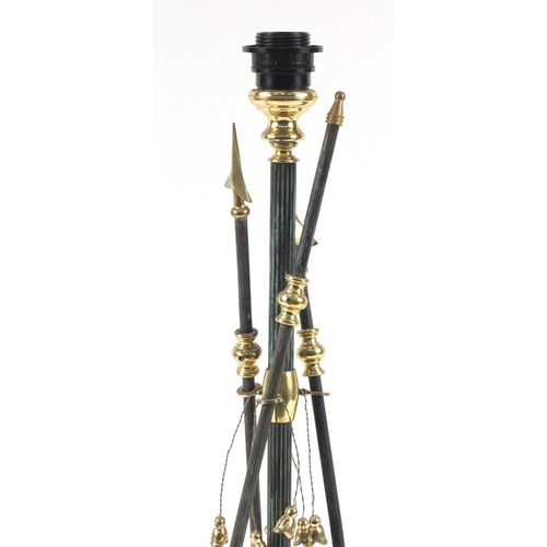 2190 - Bronzed and brass arrow design table lamp with lion paw feet, 72cm high