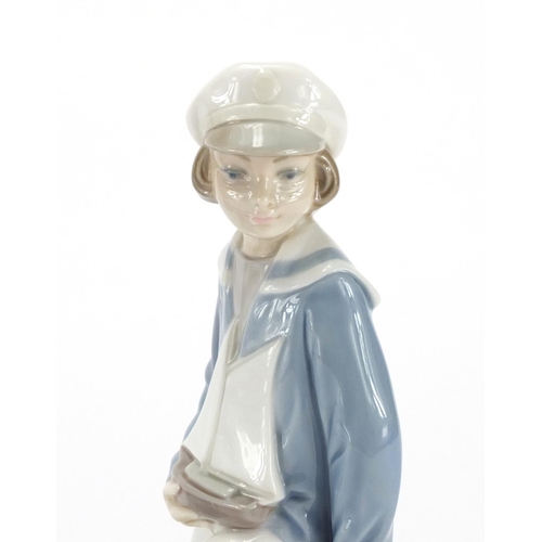 2133 - Lladro figure of a sailor and a Danish figurine of a female by L Hjorth, the largest 23cm hgih