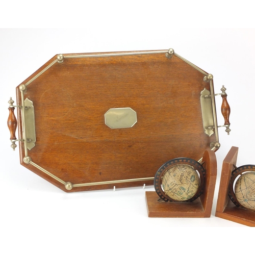 2147 - Edwardian oak gallery tray, two bottle tantalus and a pair of globe design bookends, the largest 57c... 