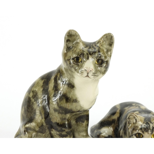 2245A - Two Winstanley pottery seated cats with beaded eyes, the largest 21.5cm high