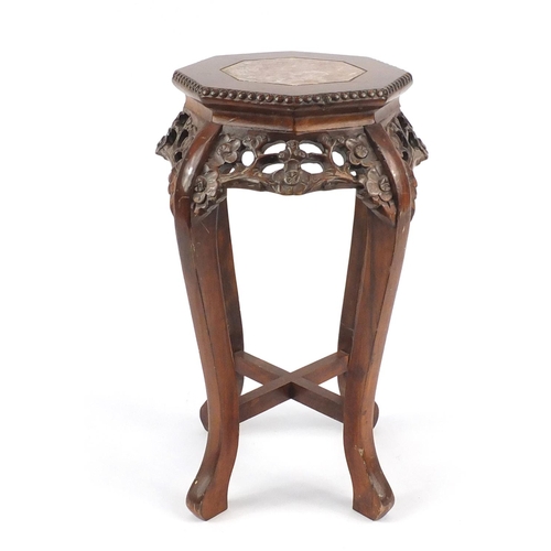 2025 - Chinese octagonal hardwood stand with inset marble top, carved and pierced with flowers, 60.5cm high