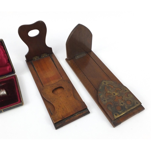2171 - Two extending wooden book slides, one of Gothic design with brass mounts and a three piece horn hand... 