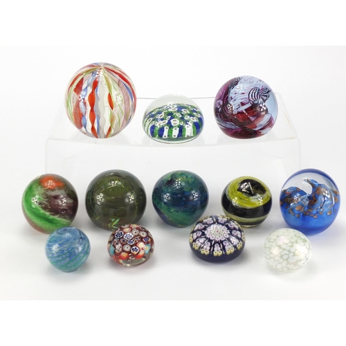 2069 - Colourful glass paperweights including Mdina, Maltese, Caithness and Millefiori examples, the larges... 
