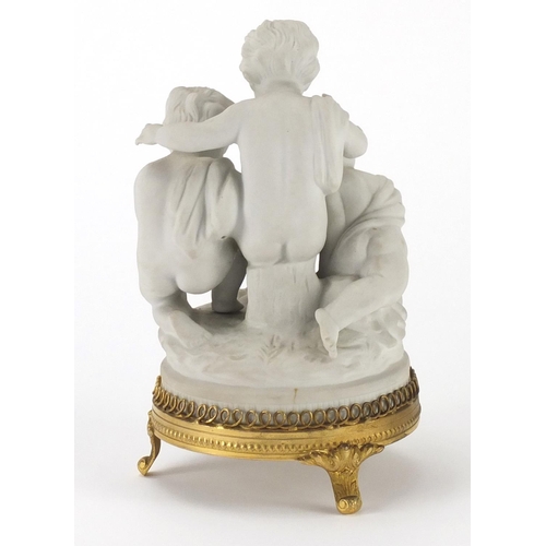 2134 - Unter Weiss Bach figure group of three young children, with gilt metal mount, 19cm high
