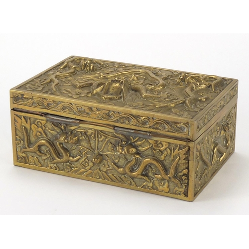 2110 - Chinese brass casket decorated in relief with dragons, 17.5cm wide