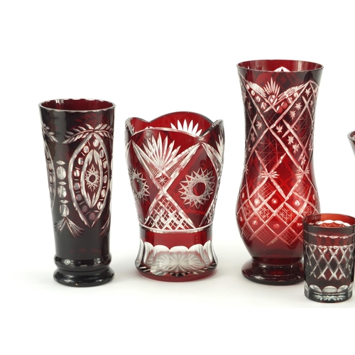 2146 - Six Bohemian ruby flashed glass vases including one etched with buildings and flowers, the largest 2... 