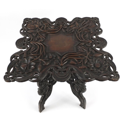 2007 - Anglo Indian folding hardwood table, profusely carved and pierced with flowers, 66cm H x 64.5cm W x ... 