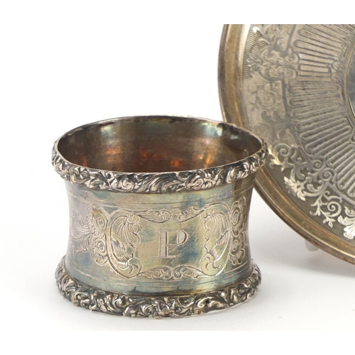 2260 - Continental silver cup and saucer and napkin ring, each with indistinct impressed marks, the saucer ... 