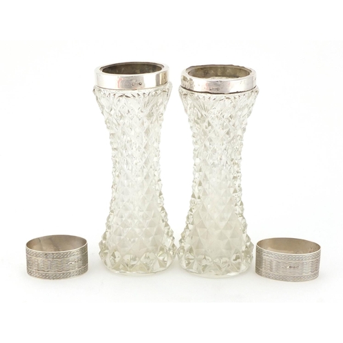 2278 - Pair of cut glass vases with silver collars and a pair of oval silver napkin rings with engine turne... 