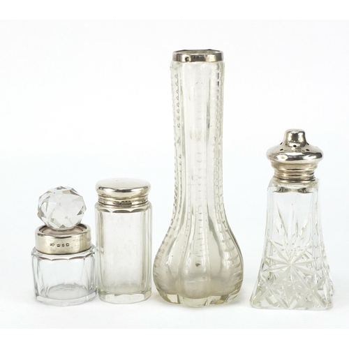 577 - Four cut glass jars with silver collars and lids, the largest 17.5cm high
