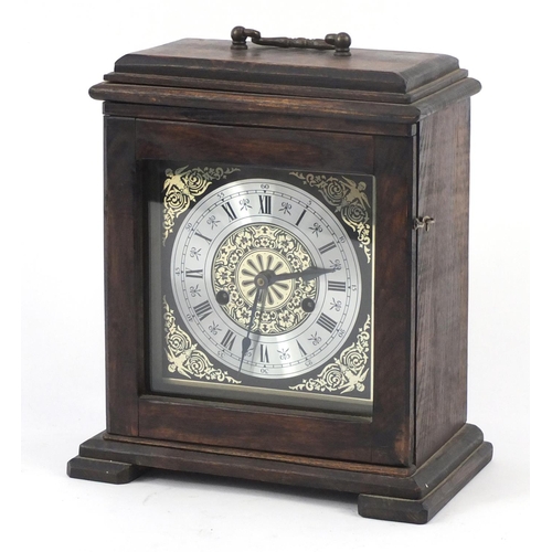 744 - Oak cased striking mantel clock with silvered chapter ring, 27cm high