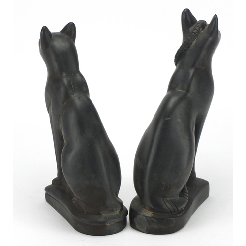 464 - Two carved stone Egyptian seated cats, the largest 27cm high